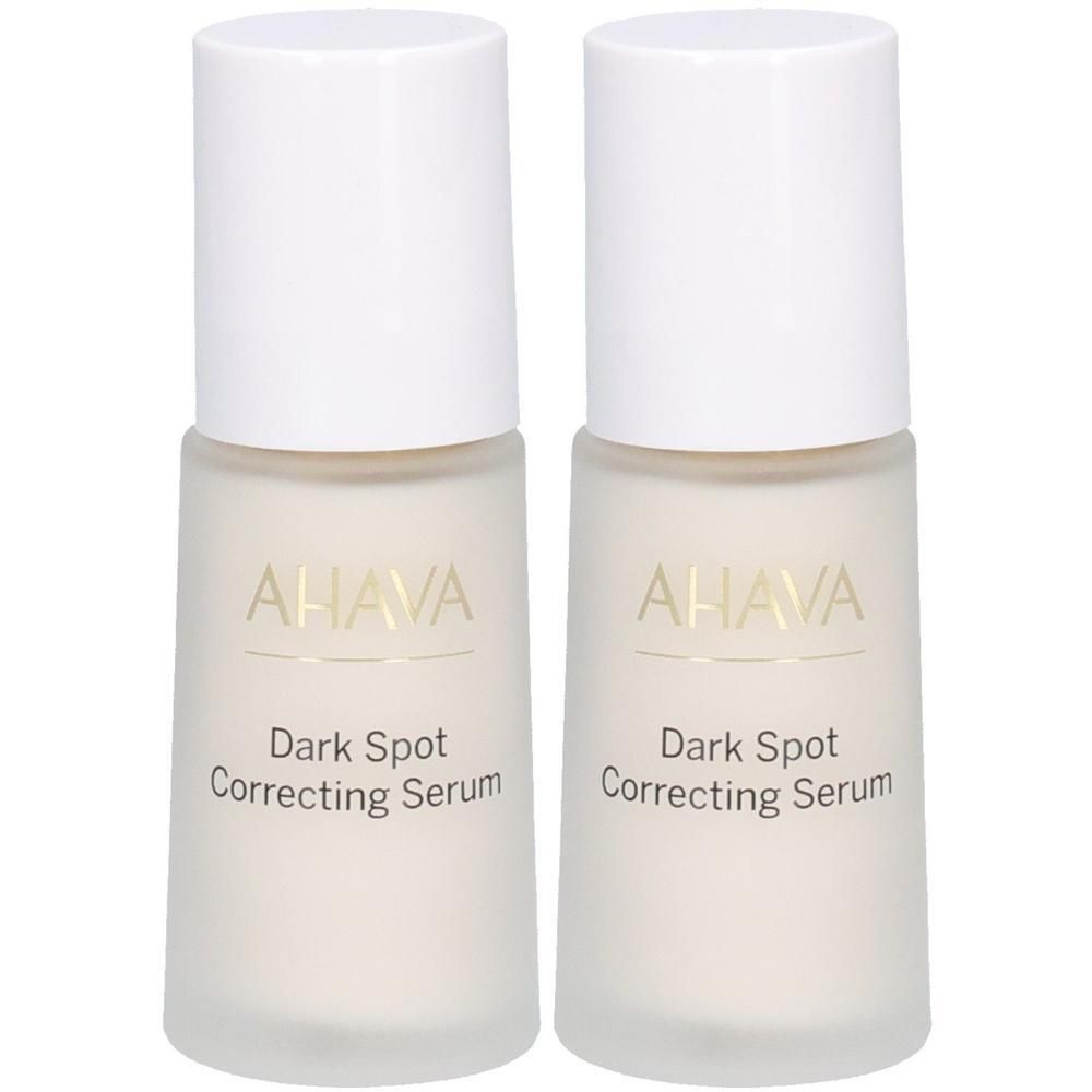 Deux flacons de sérum correcteur de taches AHAVA. Bouchons blancs, flacons transparents avec texte doré. Inscription : Dark Spot Correcting Serum.