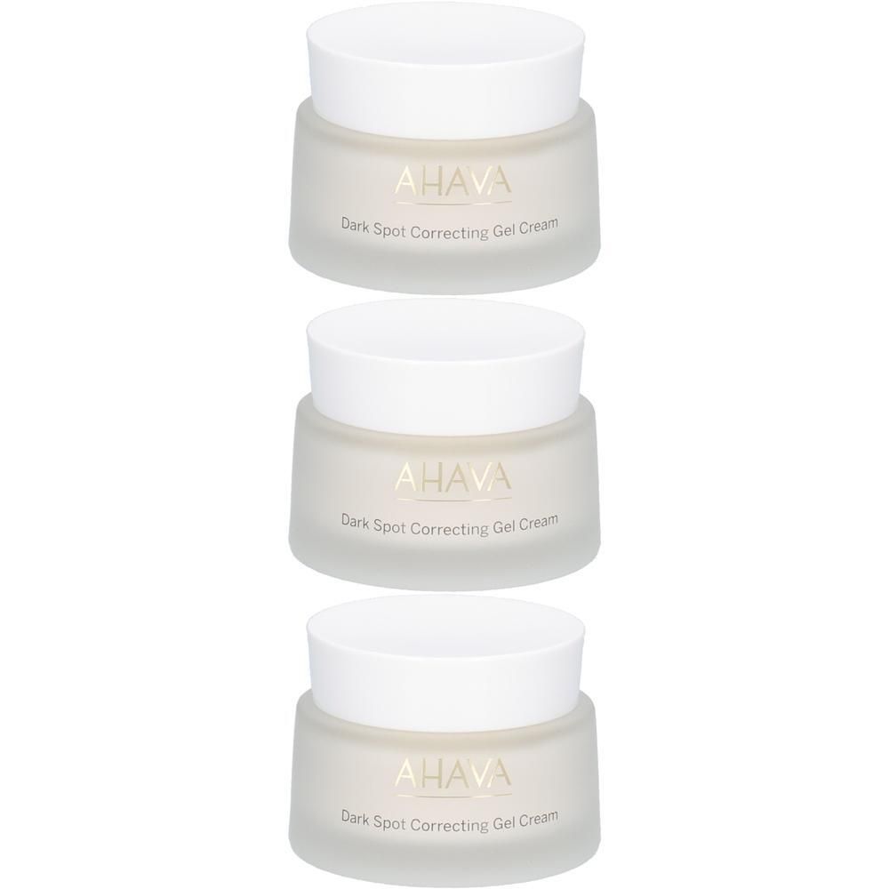 Trois pots de crème en gel AHAVA. Couvercles blancs, pots transparents. Inscription : AHAVA, Dark Spot Correcting Gel Cream.