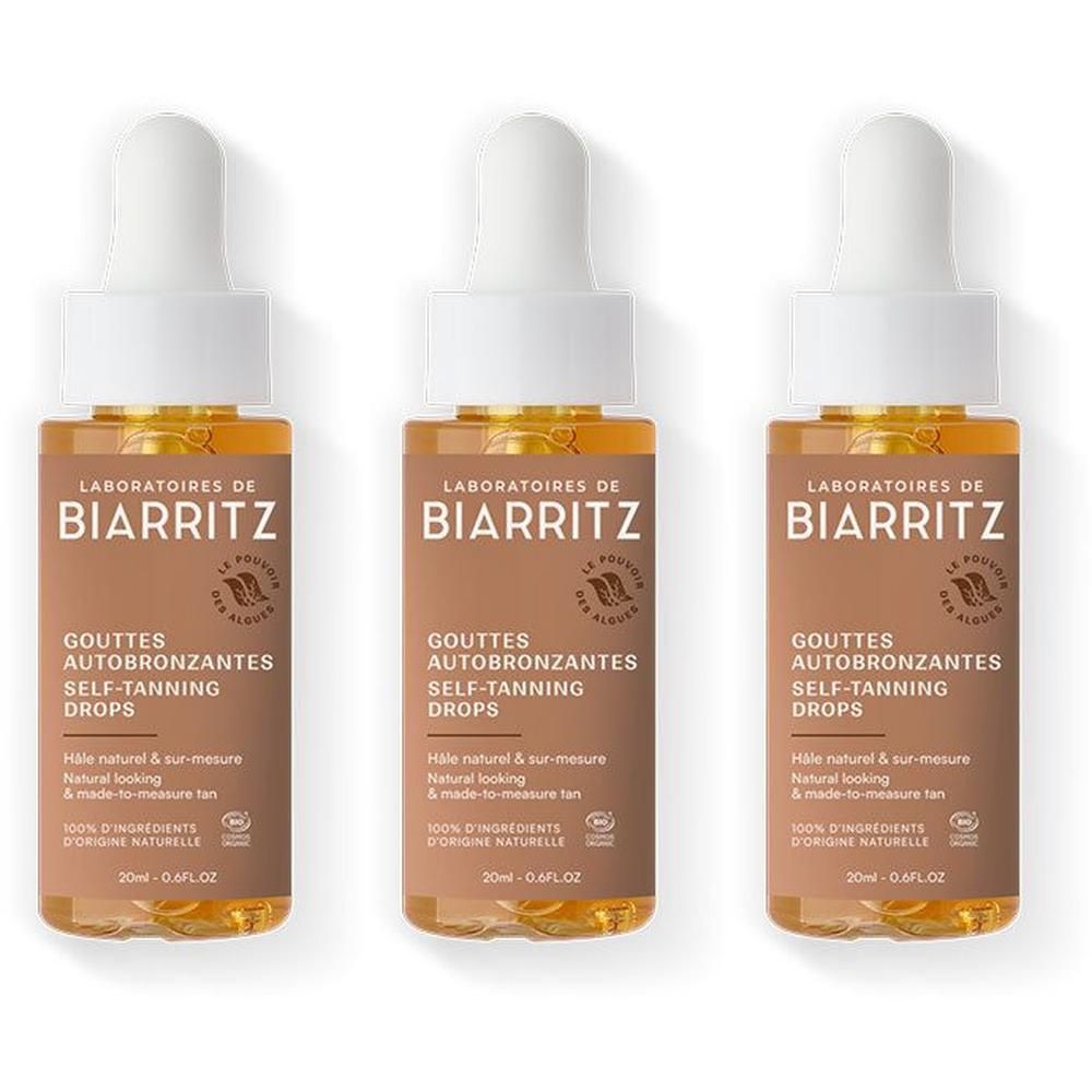 Trois flacons avec pipette. Inscription: LABORATOIRES DE BIARRITZ, GOUTTES AUTOBRONZANTES, SELF-TANNING DROPS. Liquide brun.