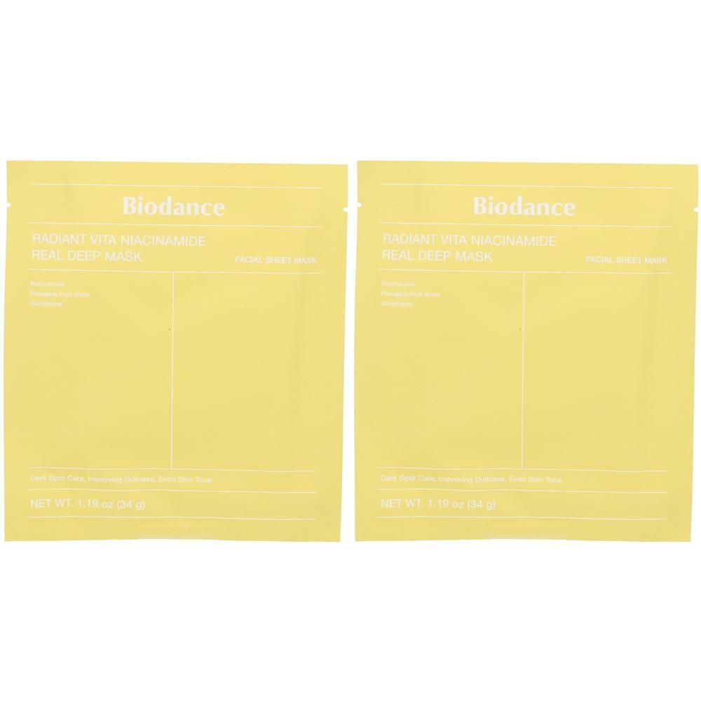 Deux sachets jaunes avec l'inscription "Biodance RADIANT VITA NIACINAMIDE REAL DEEP MASK".