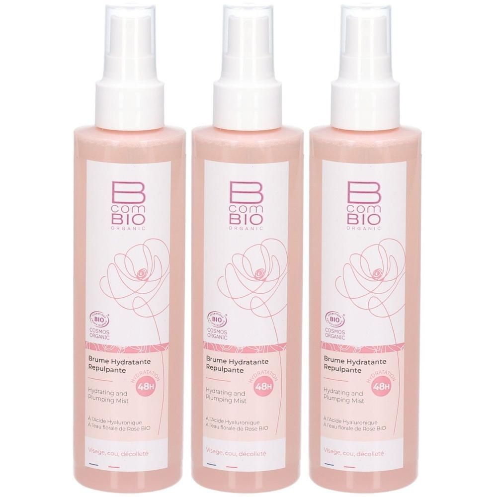 Trois flacons vaporisateurs roses. Inscription : B com BIO ORGANIC. Nom du produit et informations en français et anglais. Certification bio.