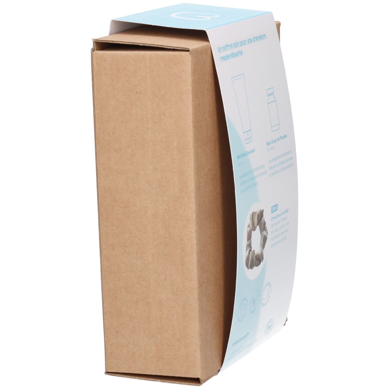 Boîte du coffret cadeau Omum & Chou², ouverte avec aperçu des produits.