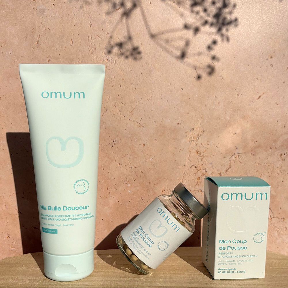 Produits capillaires Omum : shampooing, complément alimentaire et boîte.