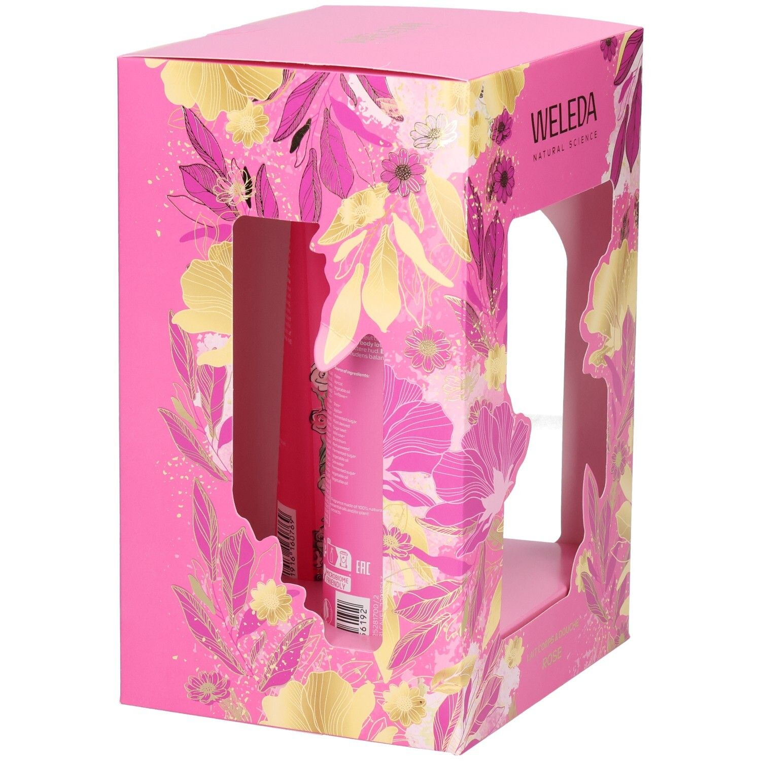 Arrière d'un emballage cadeau Weleda rose avec informations produit et motifs floraux.