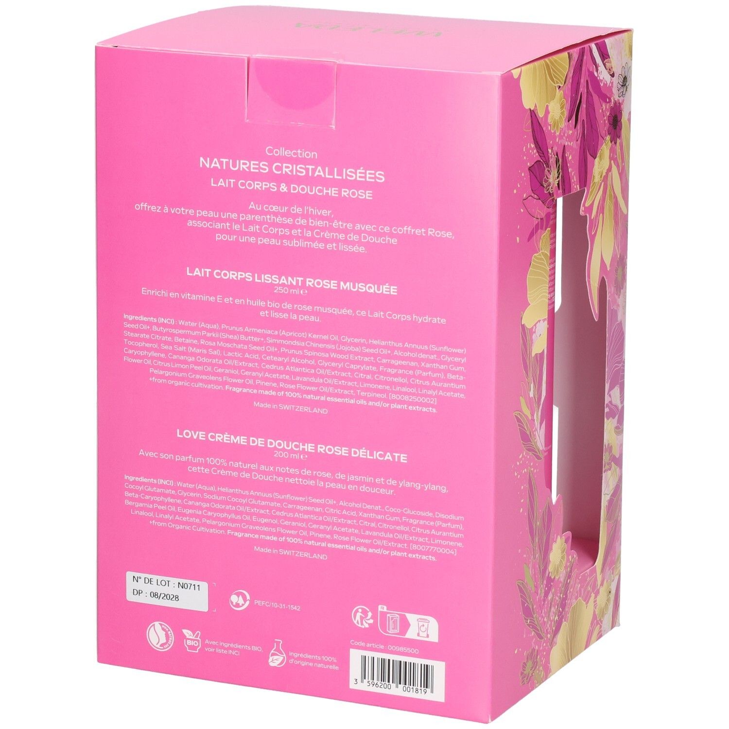 Vue latérale d'un emballage cadeau Weleda rose à motifs floraux, contenant des produits.