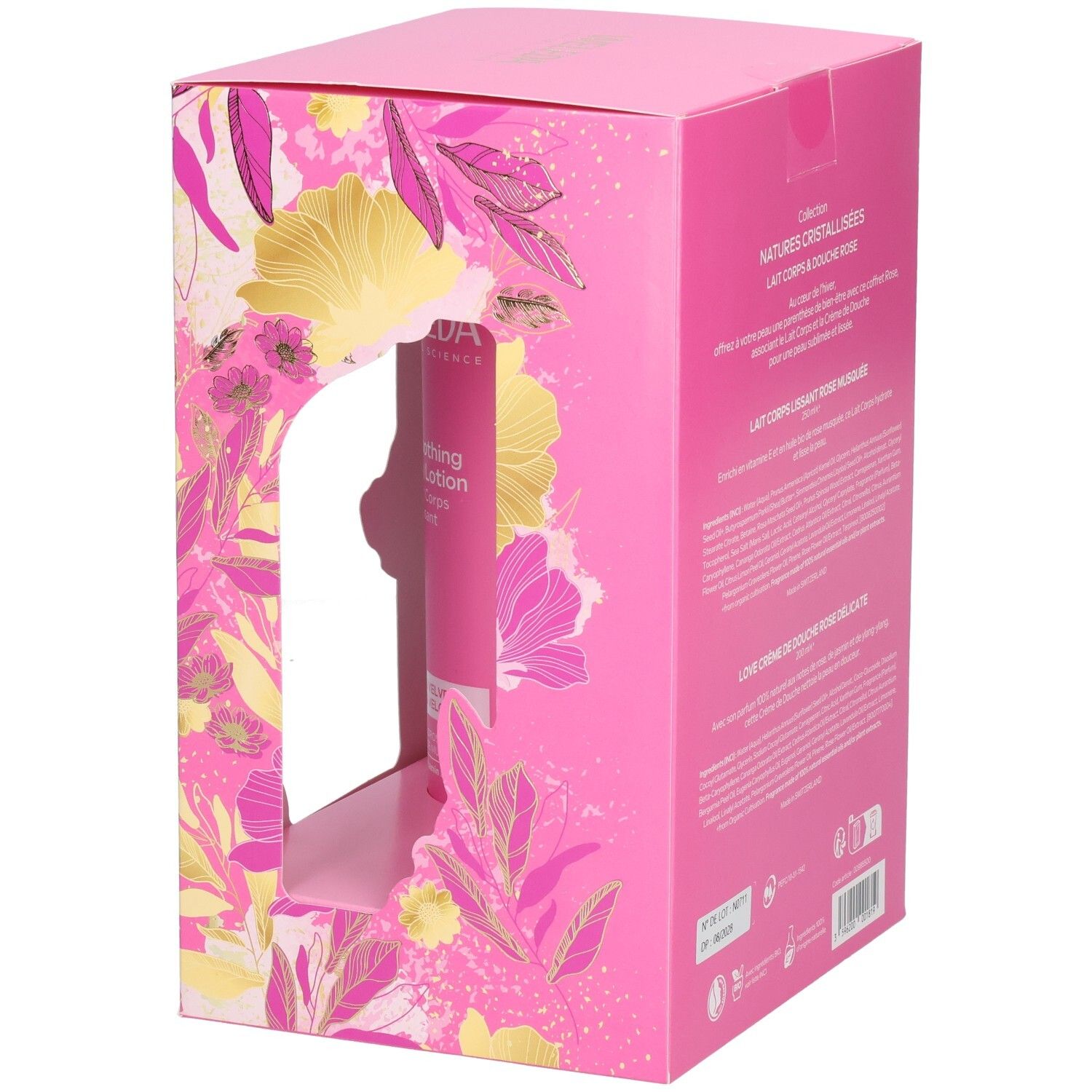 Coffret cadeau Weleda avec lait corporel et crème de douche, emballage rose à motifs floraux.