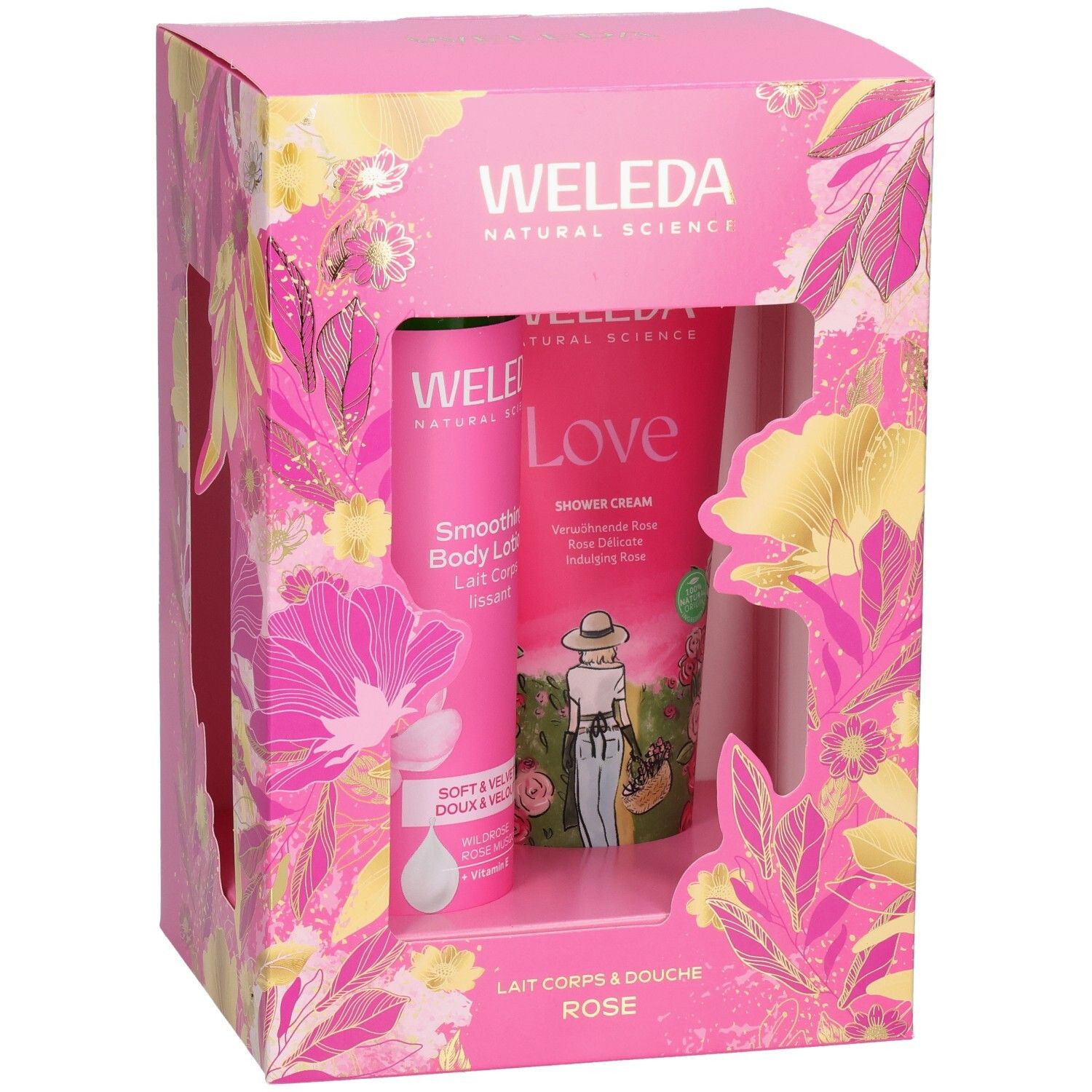 Coffret cadeau Weleda avec lait corporel et crème de douche, emballage rose à motifs floraux.