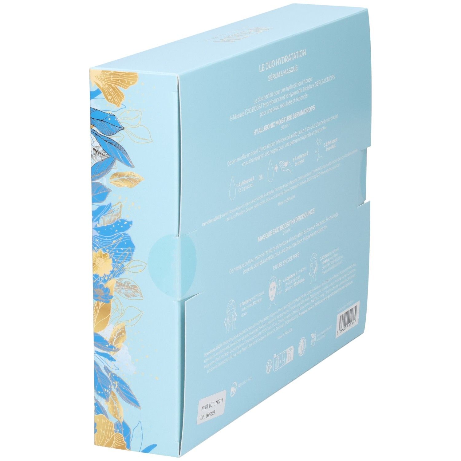 Vue latérale de la boîte cadeau WELEDA avec design floral.