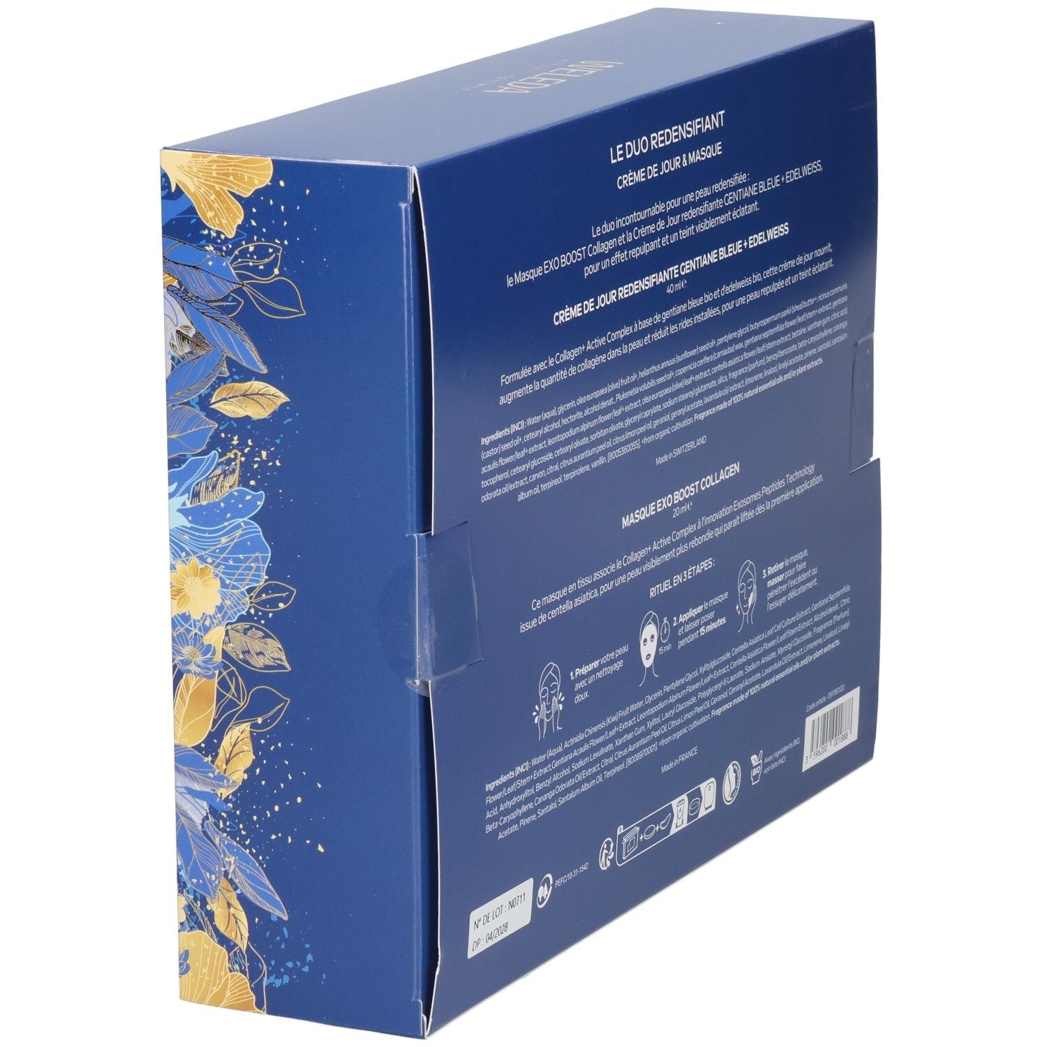 Vue latérale d'une boîte cadeau Weleda avec informations produit, motifs floraux bleus et dorés.