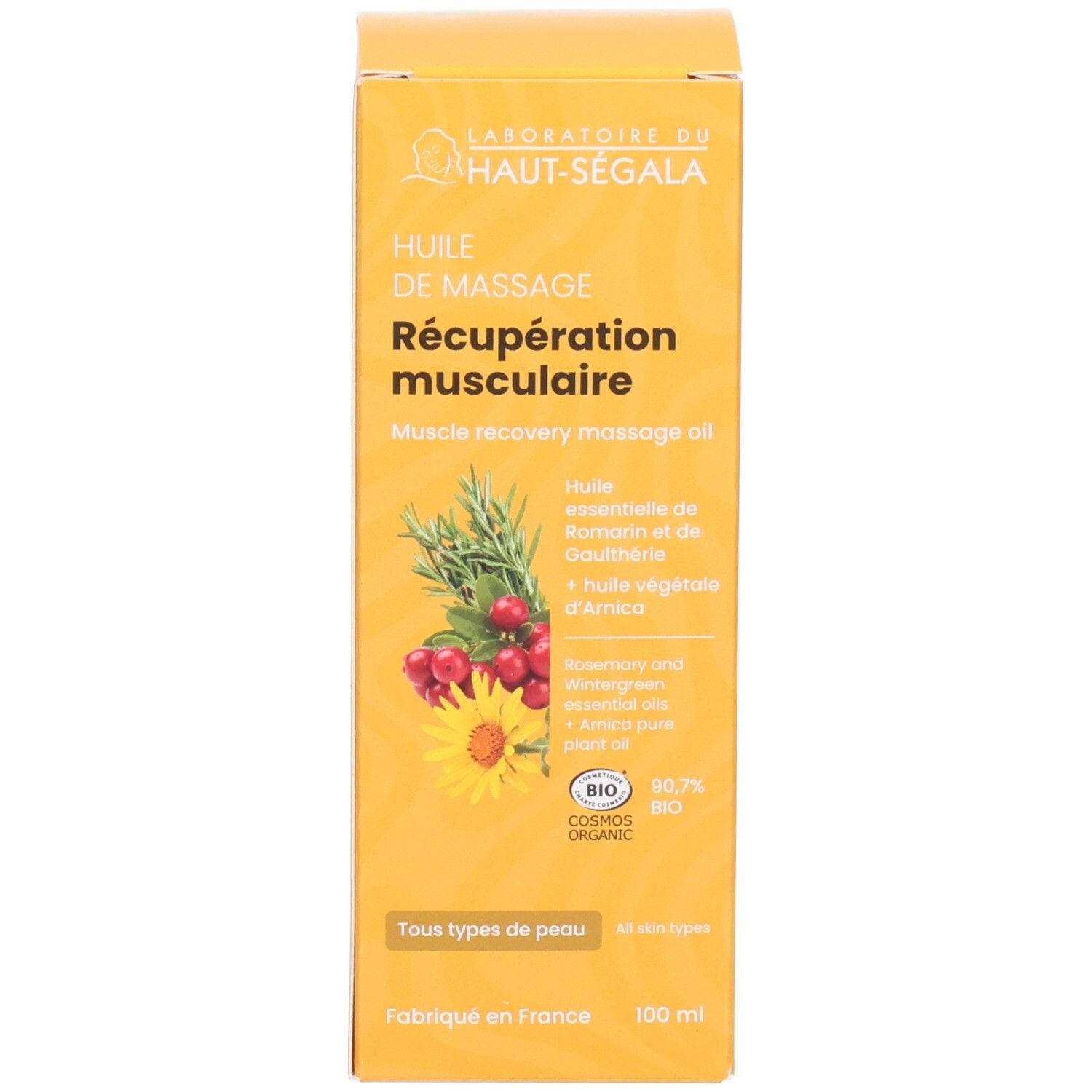 Boîte avec flacon pompe, étiquette jaune avec illustration de plantes et sceau BIO.