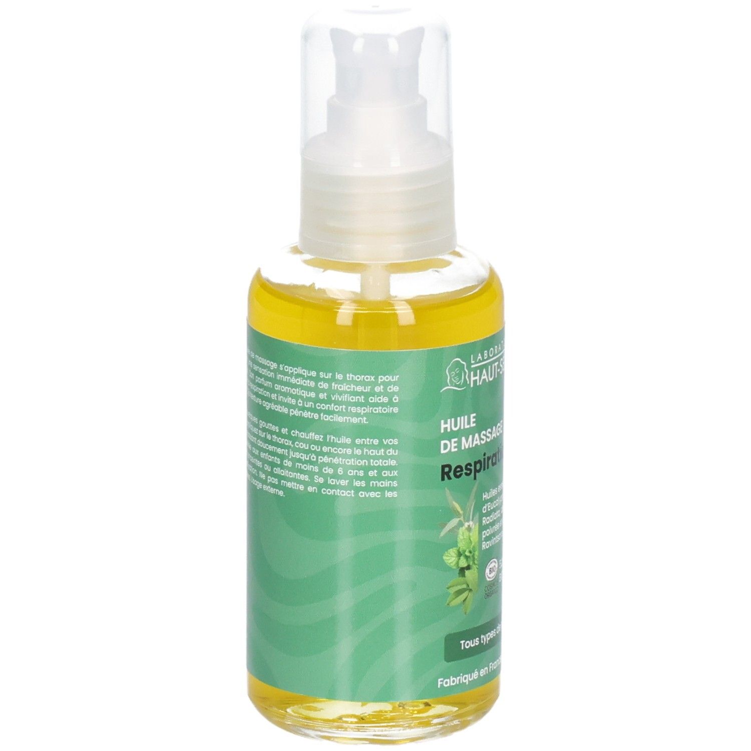 Flacon pompe, huile jaune, emballage vert avec motif végétal et texte.