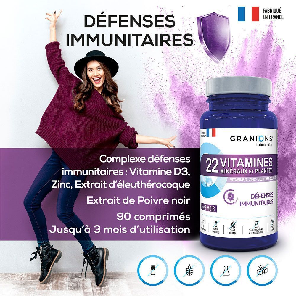 Un flacon de Laboratoire des Granions 22 Vitamines Minéraux et Plantes, à côté d'une femme.
