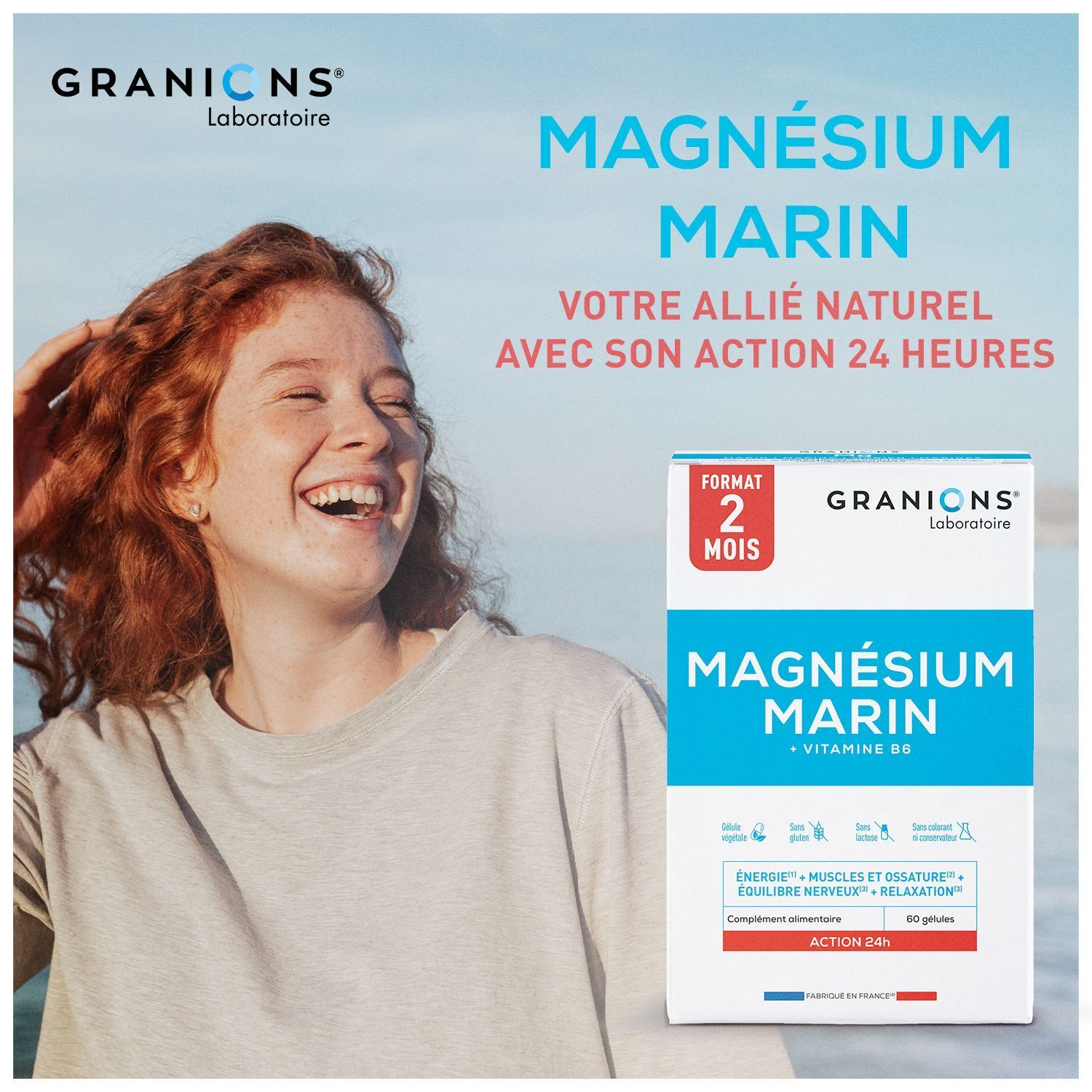 Femme souriante à côté d'une boîte de Granions Magnésium Marin 300 mg à action 24h.