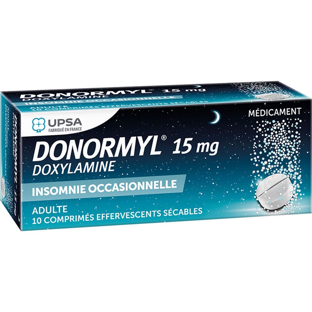 Boîte de DONORMYL 15 mg. Emballage bleu avec nom et informations. 10 comprimés effervescents sécables.