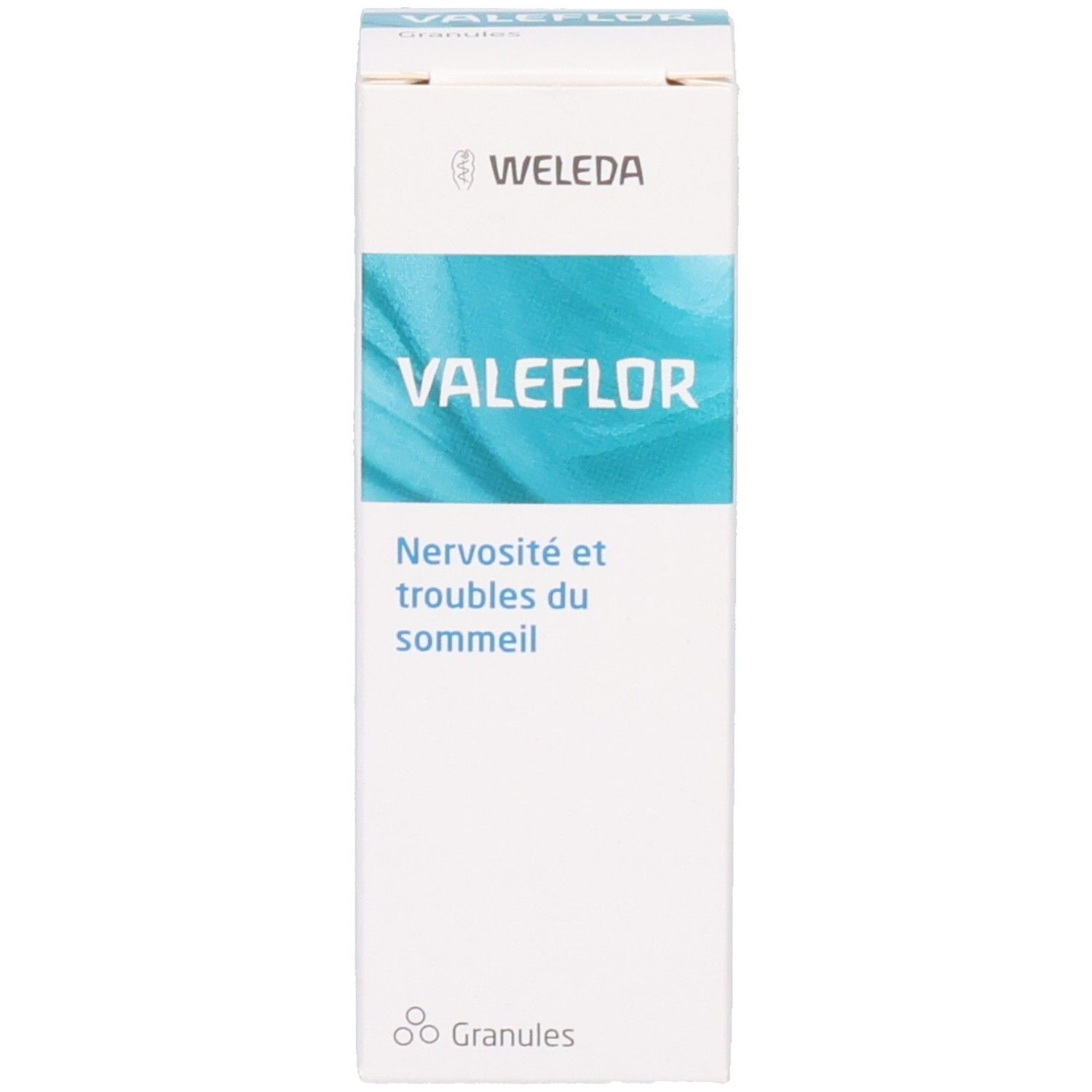Boîte VALEFLOR blanche avec motif vagues bleues. Contient informations produit et logo WELEDA.