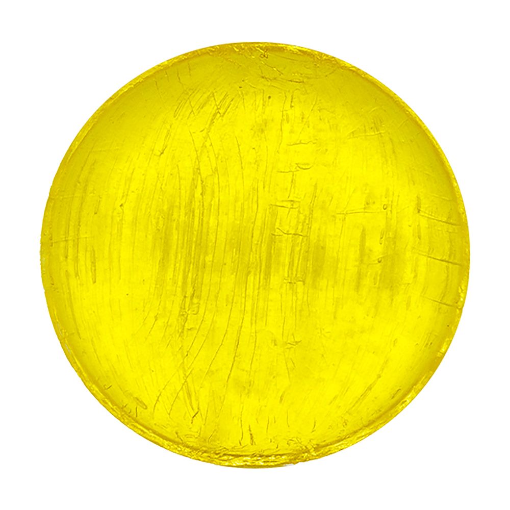 Pastille jaune ronde unique. Surface lisse, légèrement brillante. Pas d'autre texte.