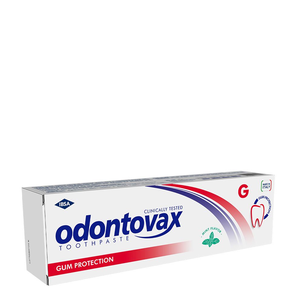 Boîte de dentifrice Odontovax, protection des gencives, testé cliniquement. Saveur menthe. Graphiques rouges et bleus.