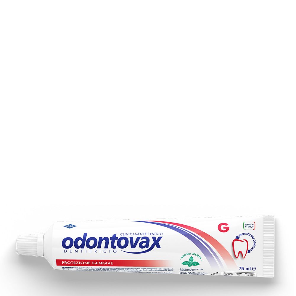 Tube de dentifrice blanc avec design bleu et rouge. Inscription: Odontovax, testé cliniquement. Saveur menthe. Protection des gencives.