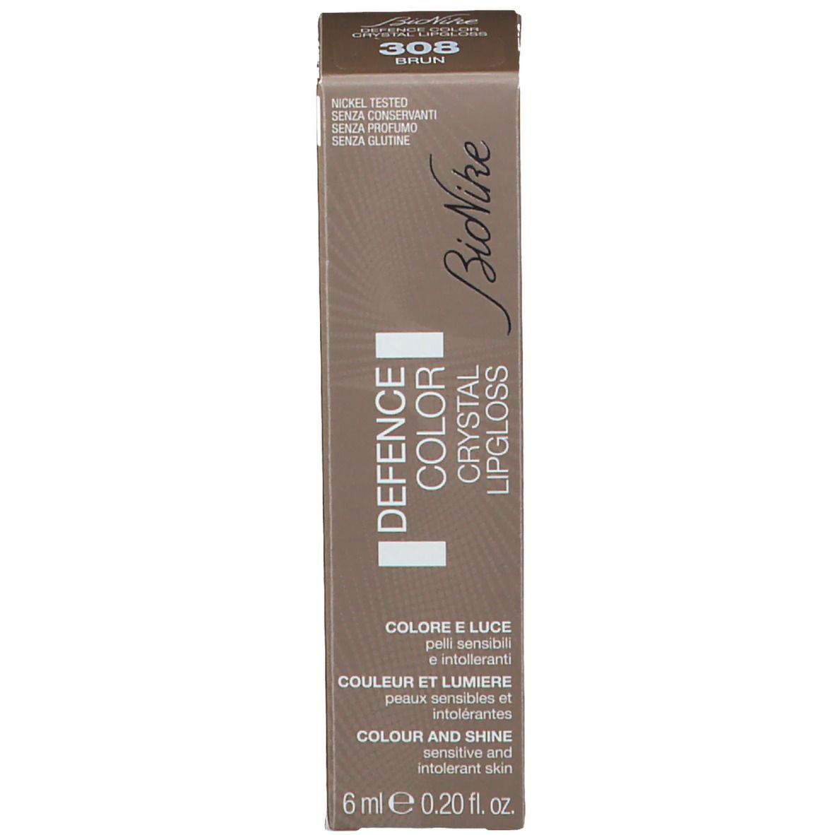 Emballage de gloss à lèvres. Inscription: DEFENCE COLOR CRYSTAL LIPGLOSS. Teinte 308 Brun.