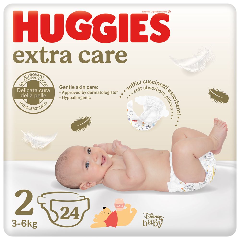 Couches Huggies Extra Care, taille 2, 3-6 kg. Bébé sur l'emballage. Inscriptions : Winnie l'ourson, testé dermatologiquement.