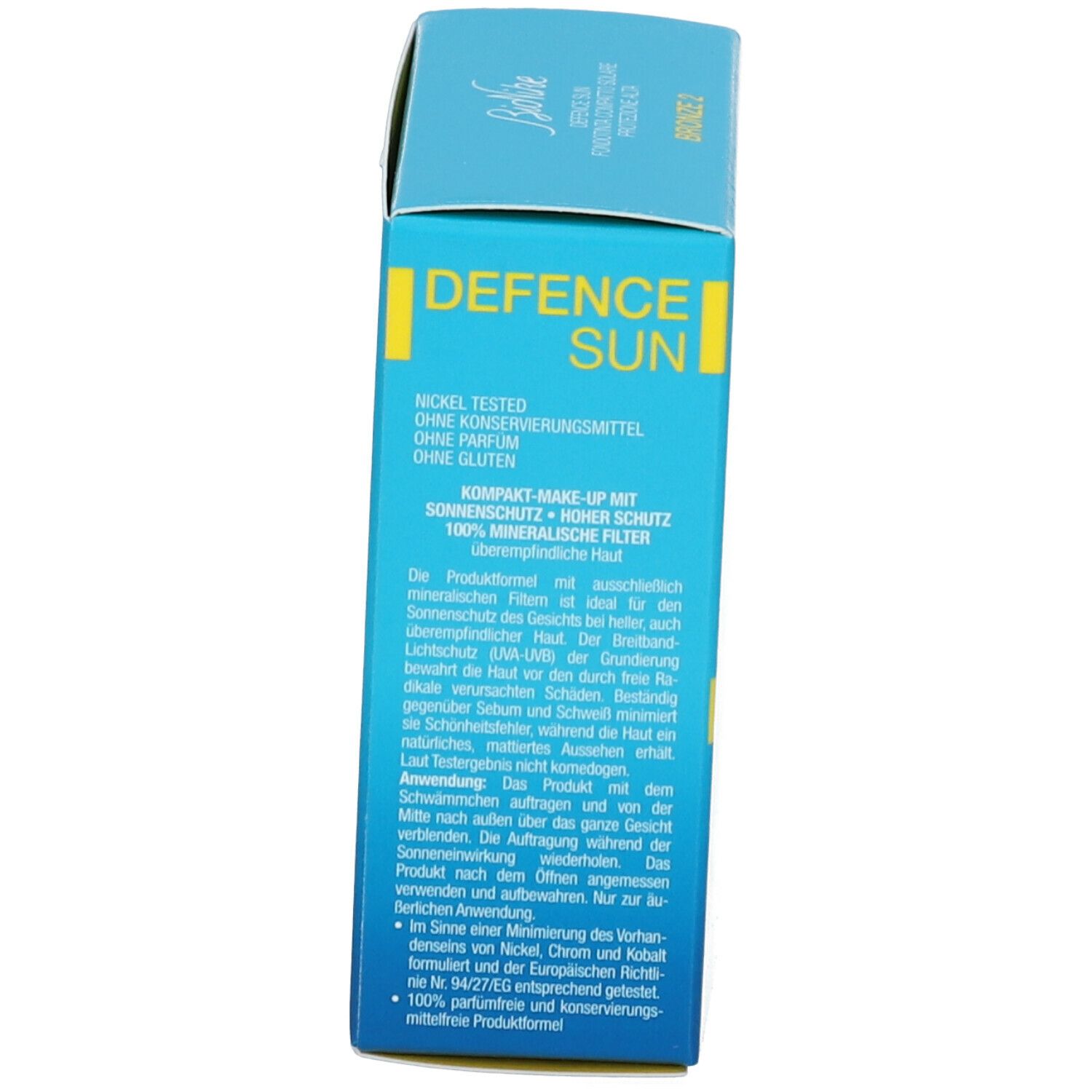 Boîte bleu clair. Inscription DEFENCE SUN, marque BioNike. Texte multilingue. Côté de l'emballage.