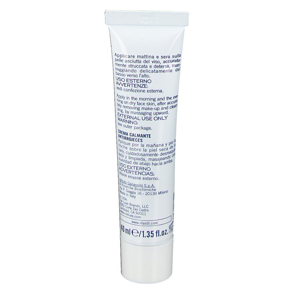Dos d'un tube de crème blanc. Texte en plusieurs langues, y compris instructions et avertissements. 40 ml/1.35 fl. oz.