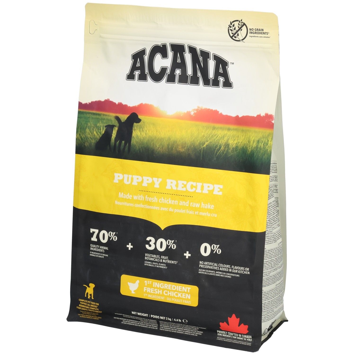 Sac ACANA Puppy Recipe. Design jaune et noir avec silhouette de chiots. Contient 70% d'ingrédients animaux, 30% de légumes, fruits, 0% d'additifs artificiels.