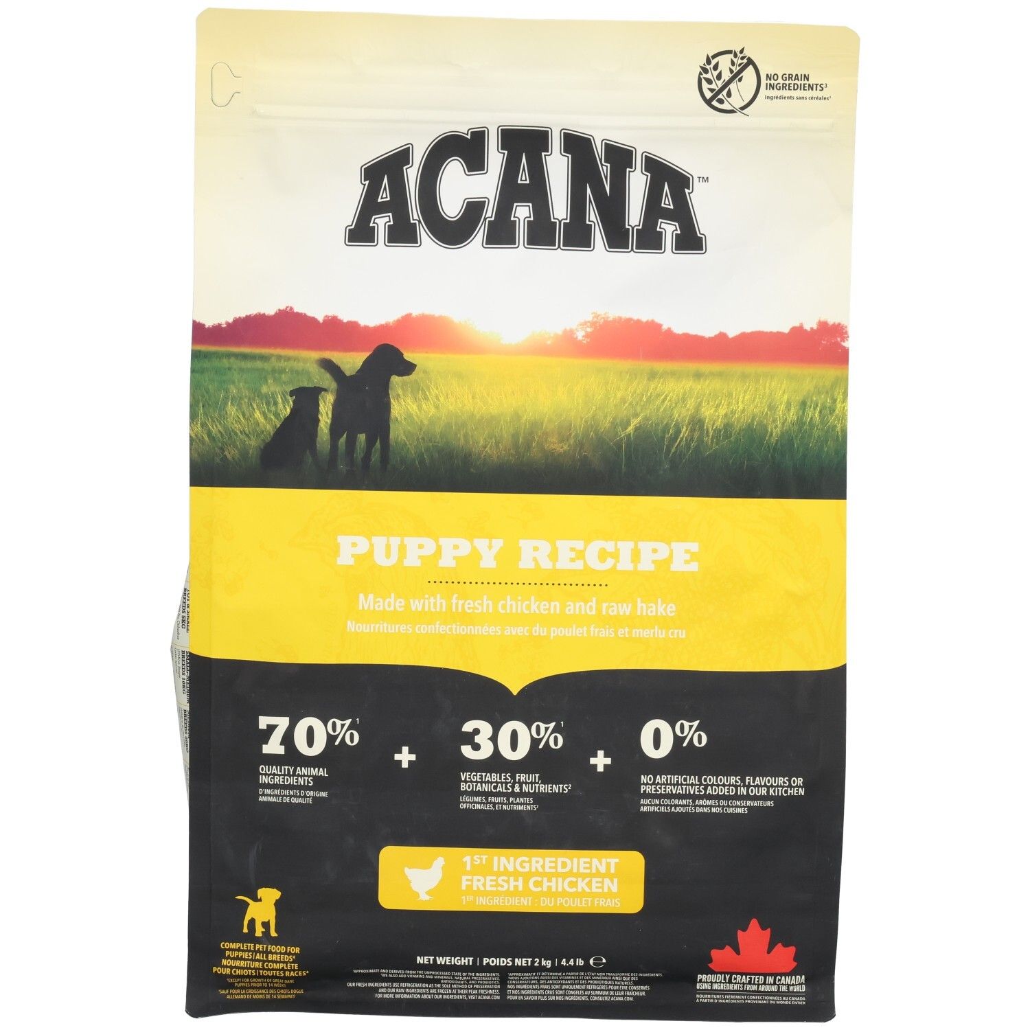 Sac ACANA Puppy Recipe. Design jaune et noir avec silhouette de chiots. Contient 70% d'ingrédients animaux, 30% de légumes, fruits, 0% d'additifs artificiels.