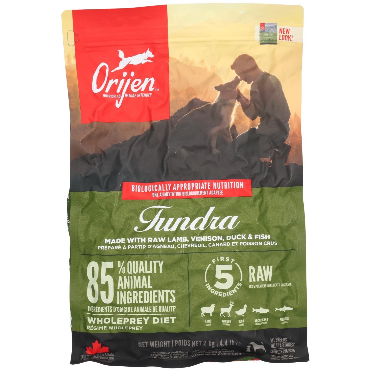 Sac de nourriture pour chien Orijen Tundra, 2kg, avec image d'un homme et d'un chien.