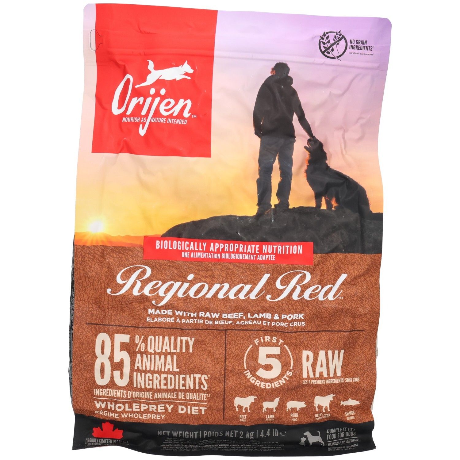 Sac ORIJEN DOG REGIONAL RED. Inscription "Regional Red", 85% ingrédients animaux. Image d'un homme et d'un chien.
