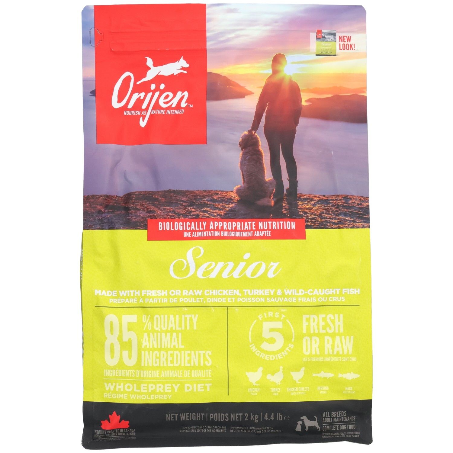 Sac de nourriture Orijen Senior pour chien avec image d'un homme et d'un chien au coucher du soleil.