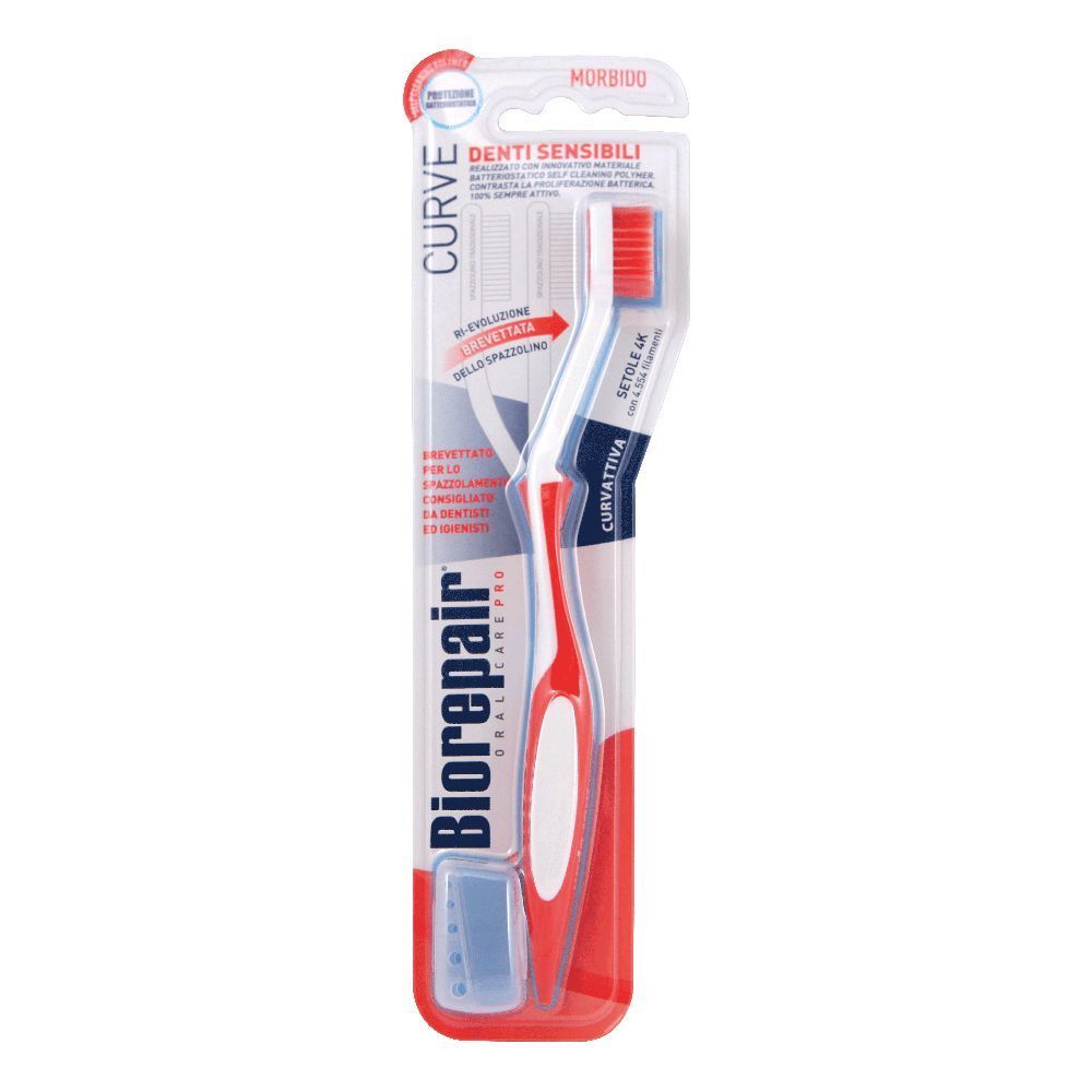 Brosse à dents dans son emballage. Manche rouge, tête blanche avec poils rouges. Marque visible : Biorepair.