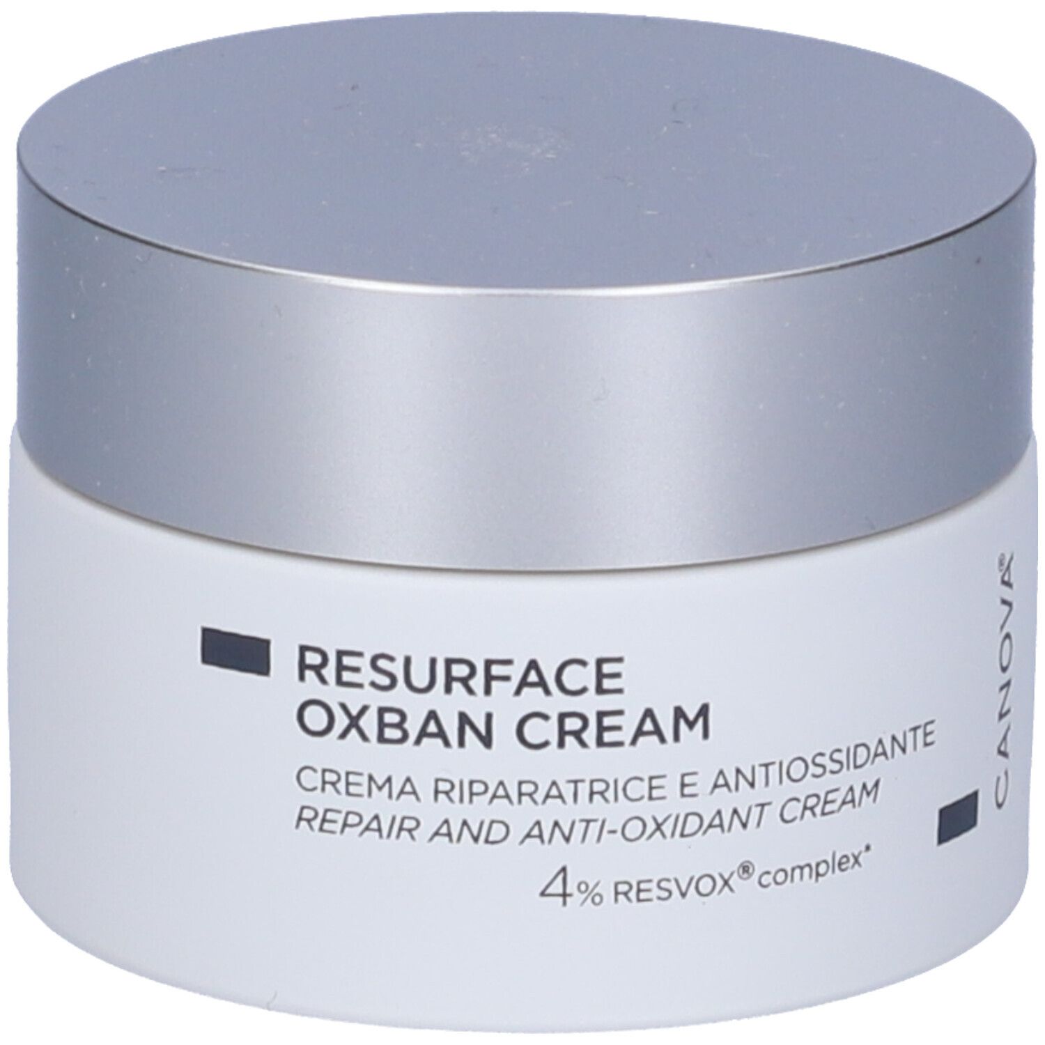 Pot de crème avec couvercle argenté. Inscription: RESURFACE OXBAN CREAM, Crème réparatrice et antioxydante, 4% RESVOX complex.
