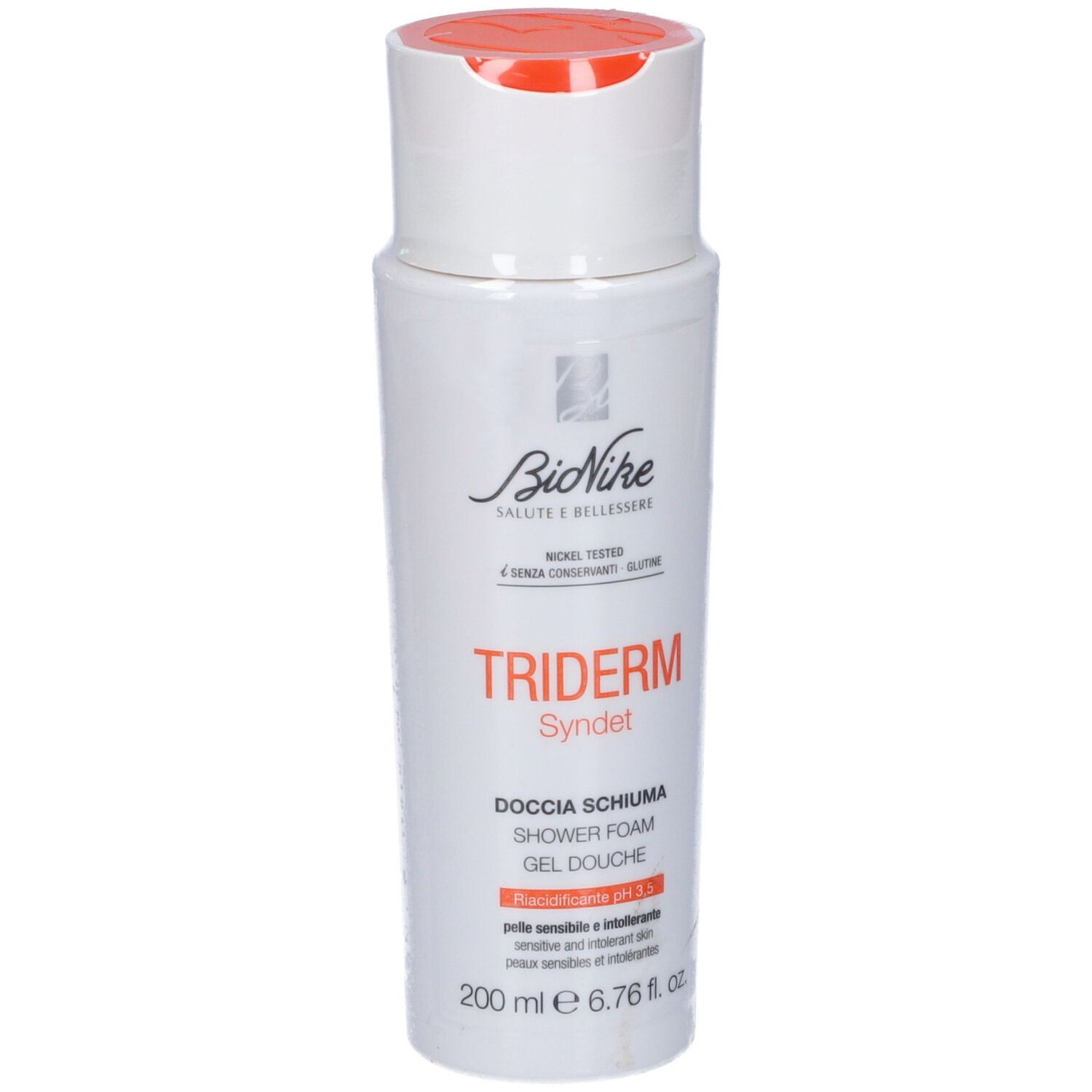 Flacon blanc avec bouchon orange. Inscription: Triderm Syndet, gel douche, pH 5.5. Marque: BioNike.