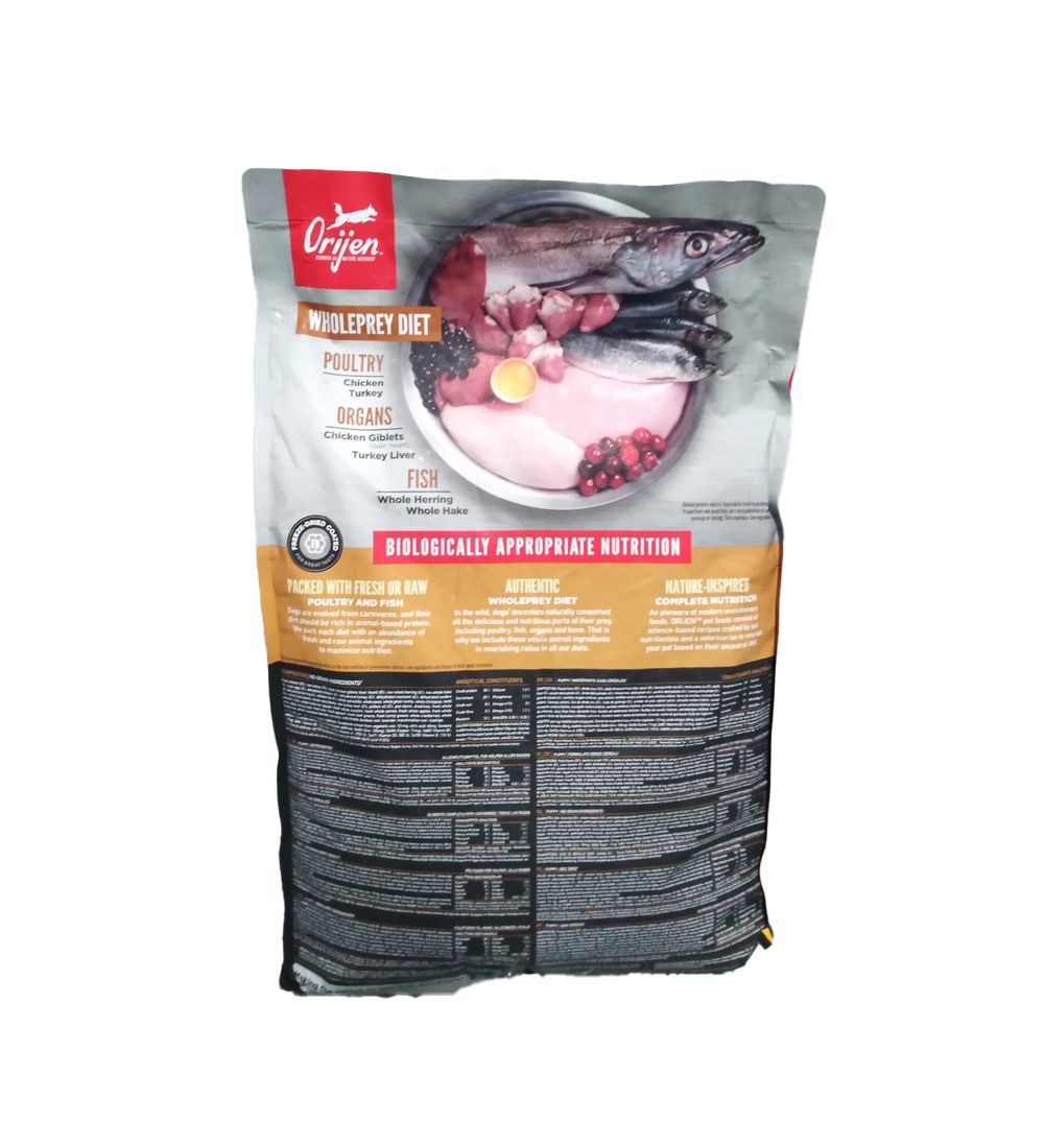 Dos du sac de nourriture pour chiots Orijen. Contient des informations sur la composition et la valeur nutritionnelle de la nourriture.