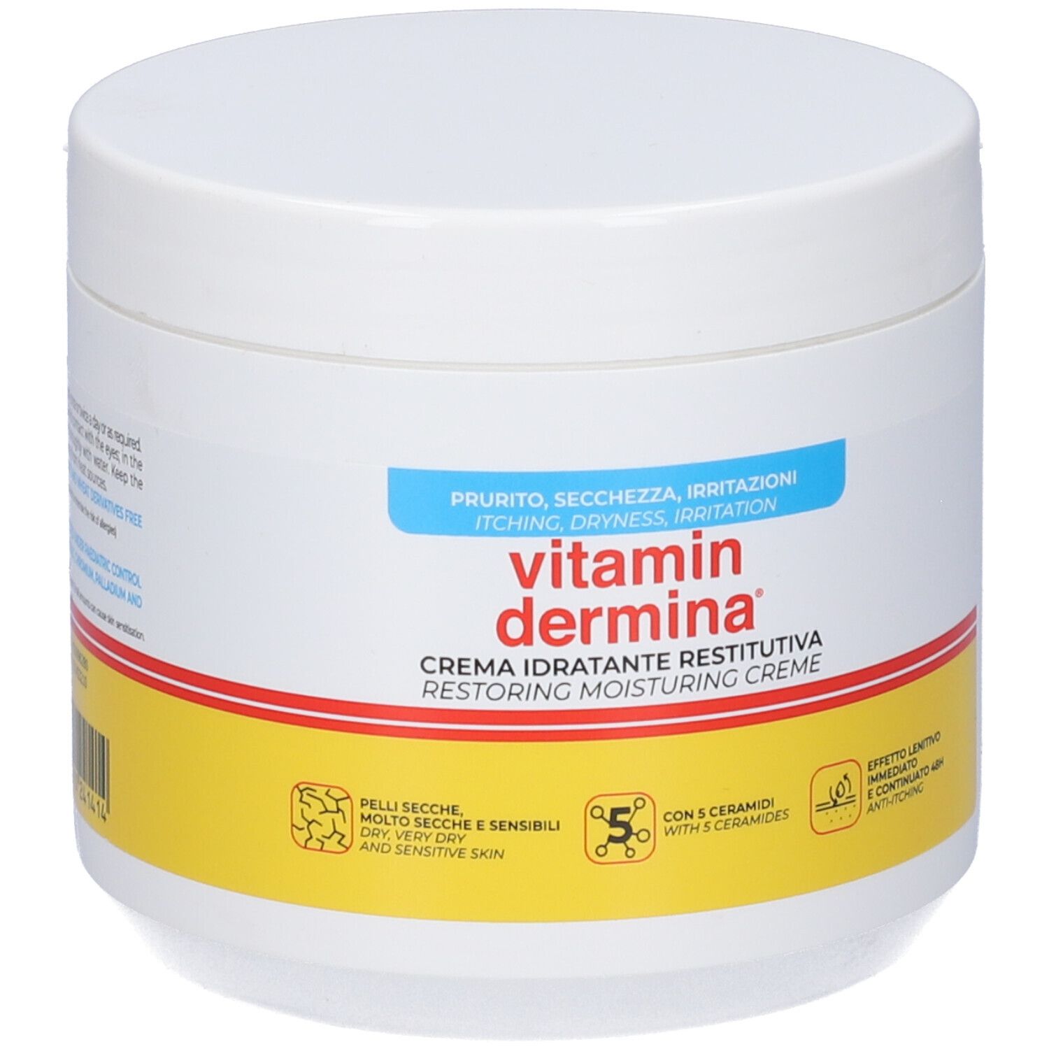 Pot blanc avec texte rouge et jaune. Inscription : Vitamin Dermina, Crème idratante restitutiva. Pour peaux sèches et sensibles.