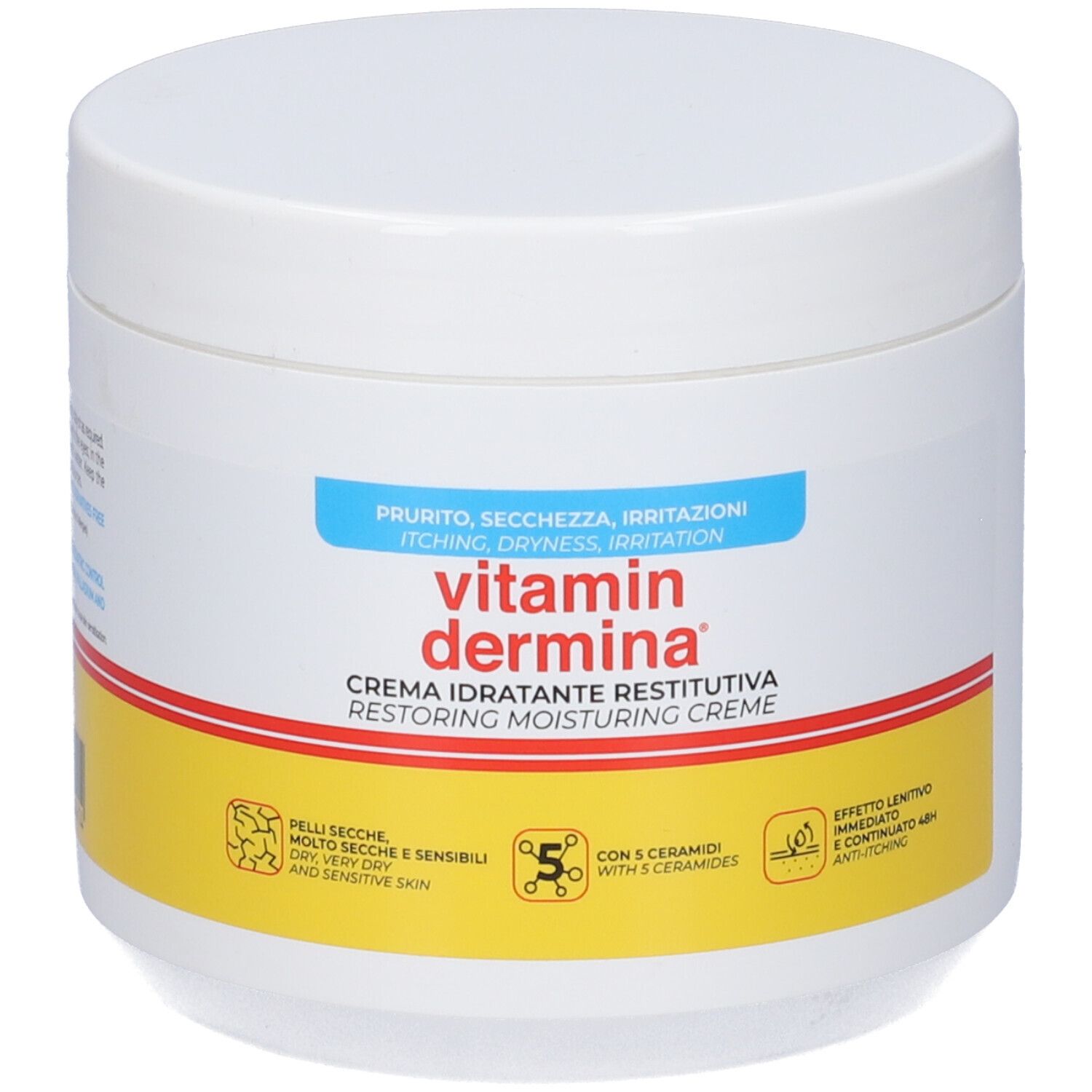 Pot blanc avec texte rouge et jaune. Inscription : Vitamin Dermina, Crème idratante restitutiva. Pour peaux sèches et sensibles.