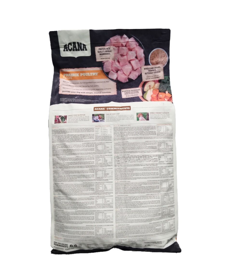 Dos du sac de nourriture pour chiens ACANA PRAIRIE POULT. Contient des informations sur les ingrédients et la valeur nutritionnelle.