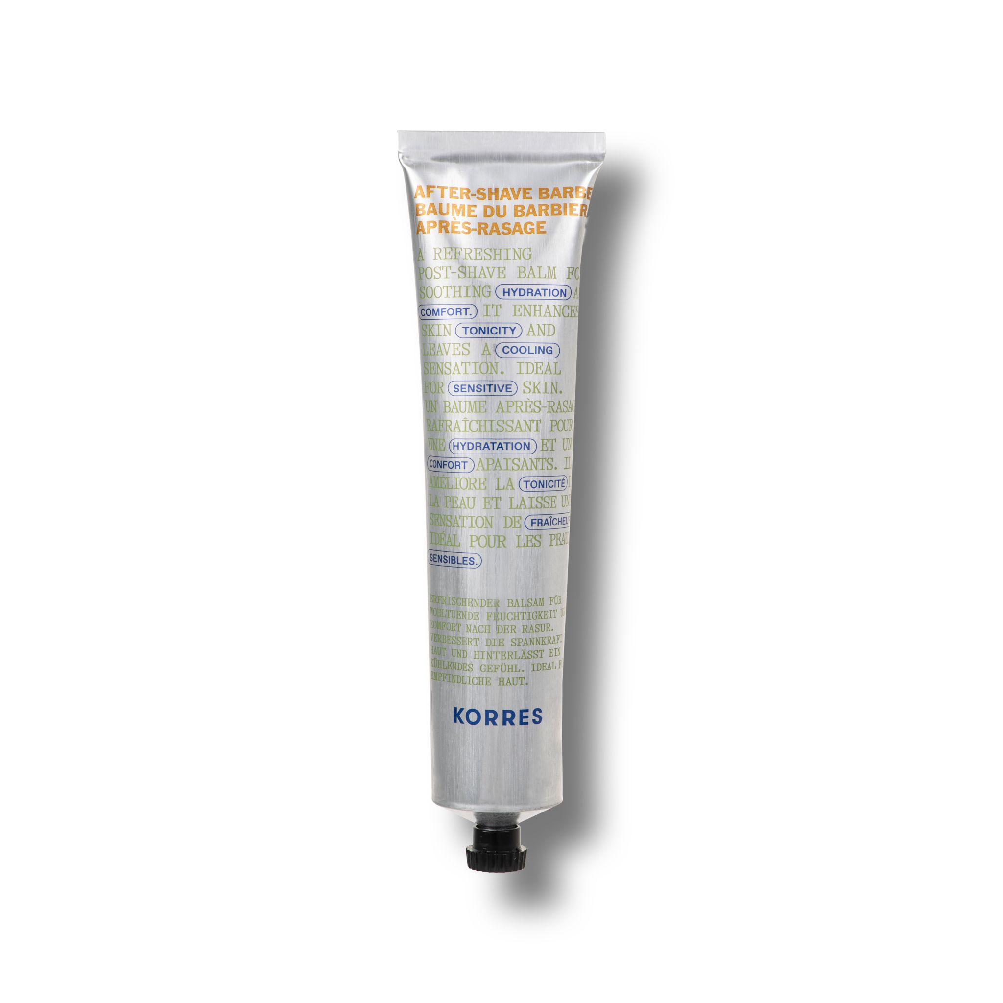 Tube argentée, bouchon noir. Texte: Aftershave Balm, KORRES. Inscriptions vertes et blanches.