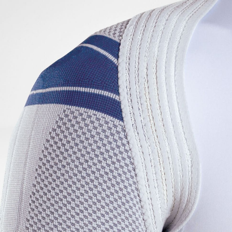 Bande d'épaule avec accent bleu. Matériau gris texturé. Structure nervurée sur le bord.