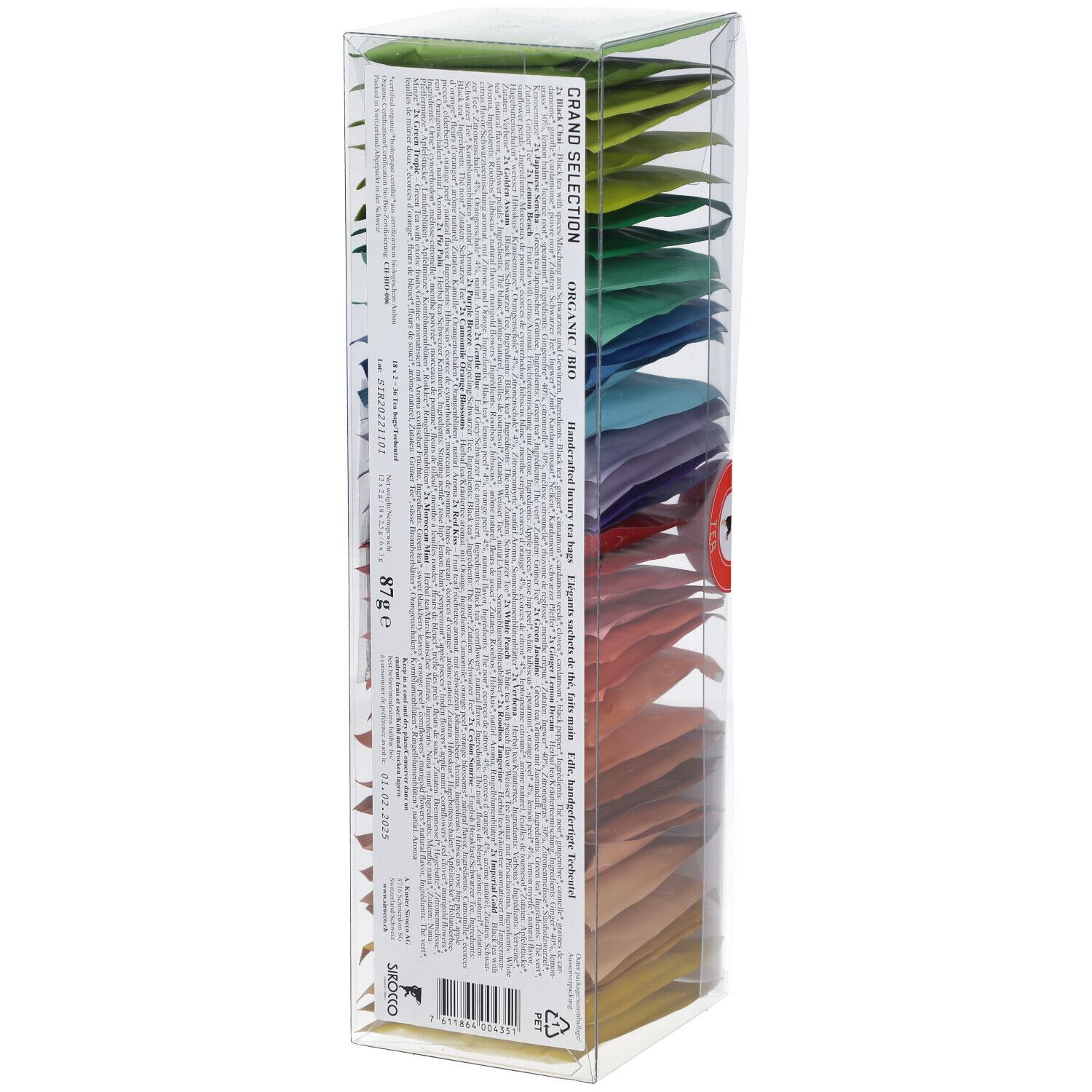 Boîte transparente avec sachets de thé colorés. Dos avec texte. Sceau rouge. Logo sur le devant.