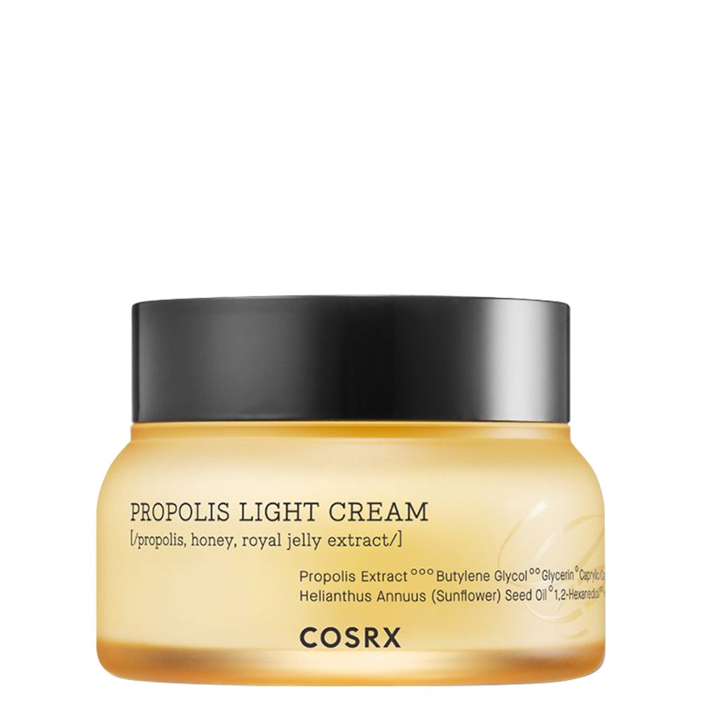 Crème légère Propolis COSRX dans un pot en verre jaune avec un couvercle noir.