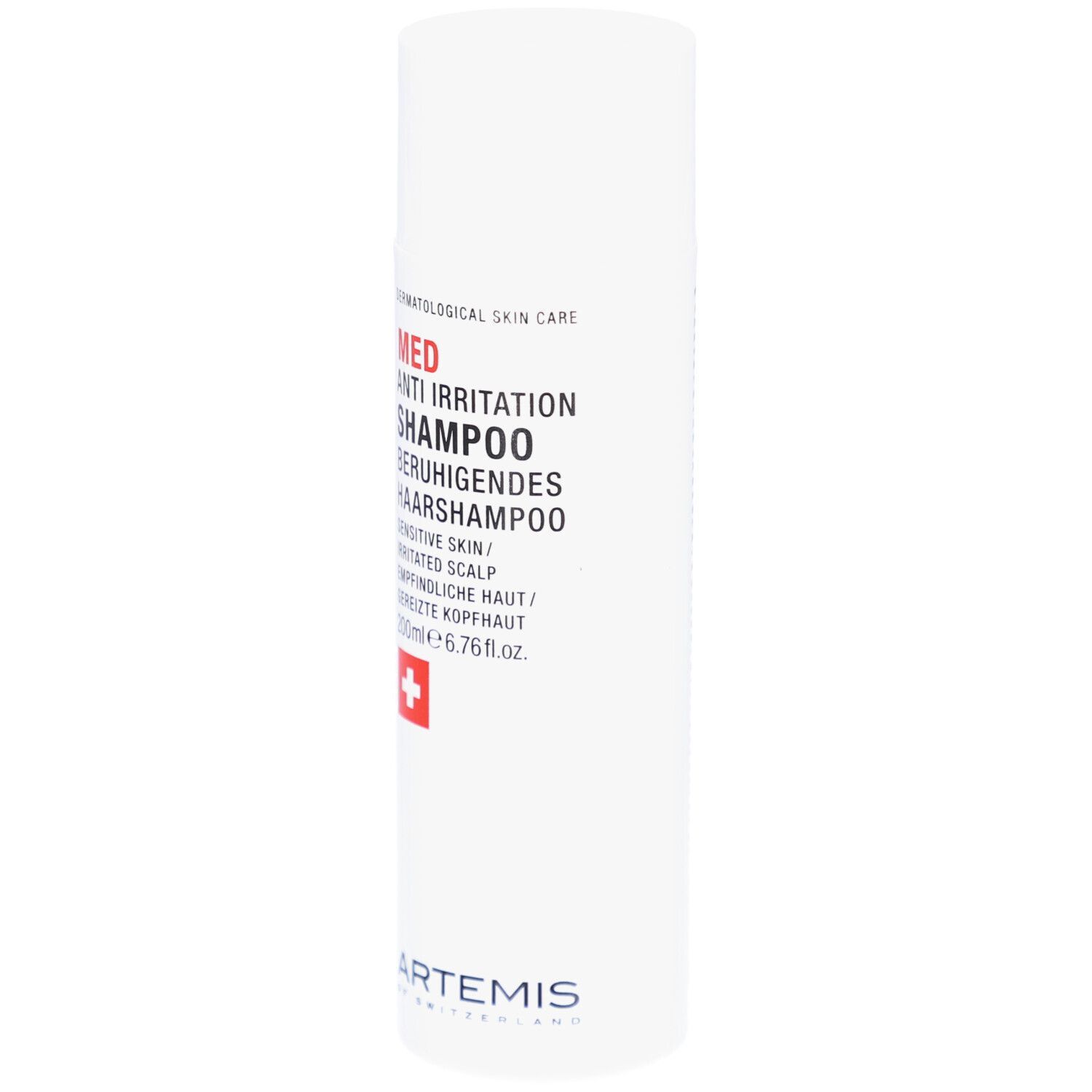 Flacon blanc avec texte rouge et noir. Croix suisse. Nom du produit: Med Anti Irritation Shampoo. Marque: Artemis.