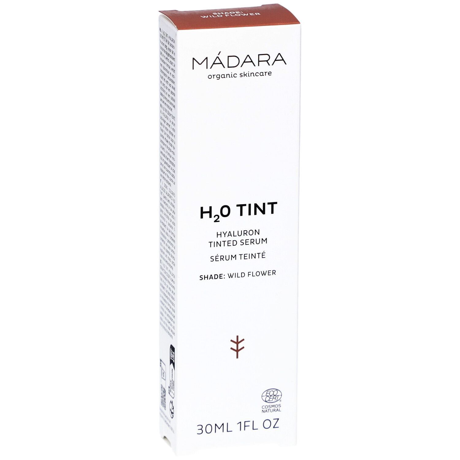 Emballage blanc avec couvercle marron. Inscription : MÁDARA, H2O TINT, Hyaluron Tinted Serum, Shade: Wild Flower. 30ml.
