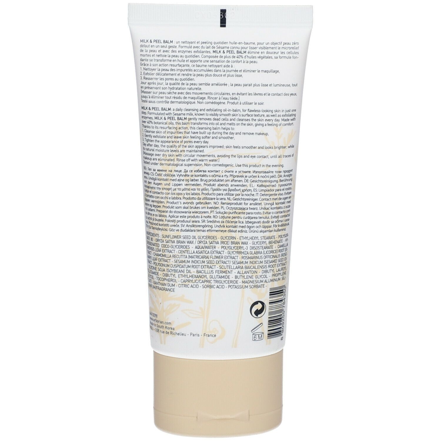Dos d'un tube blanc avec bouchon beige. Texte multilingue. Contient ingrédients et instructions.
