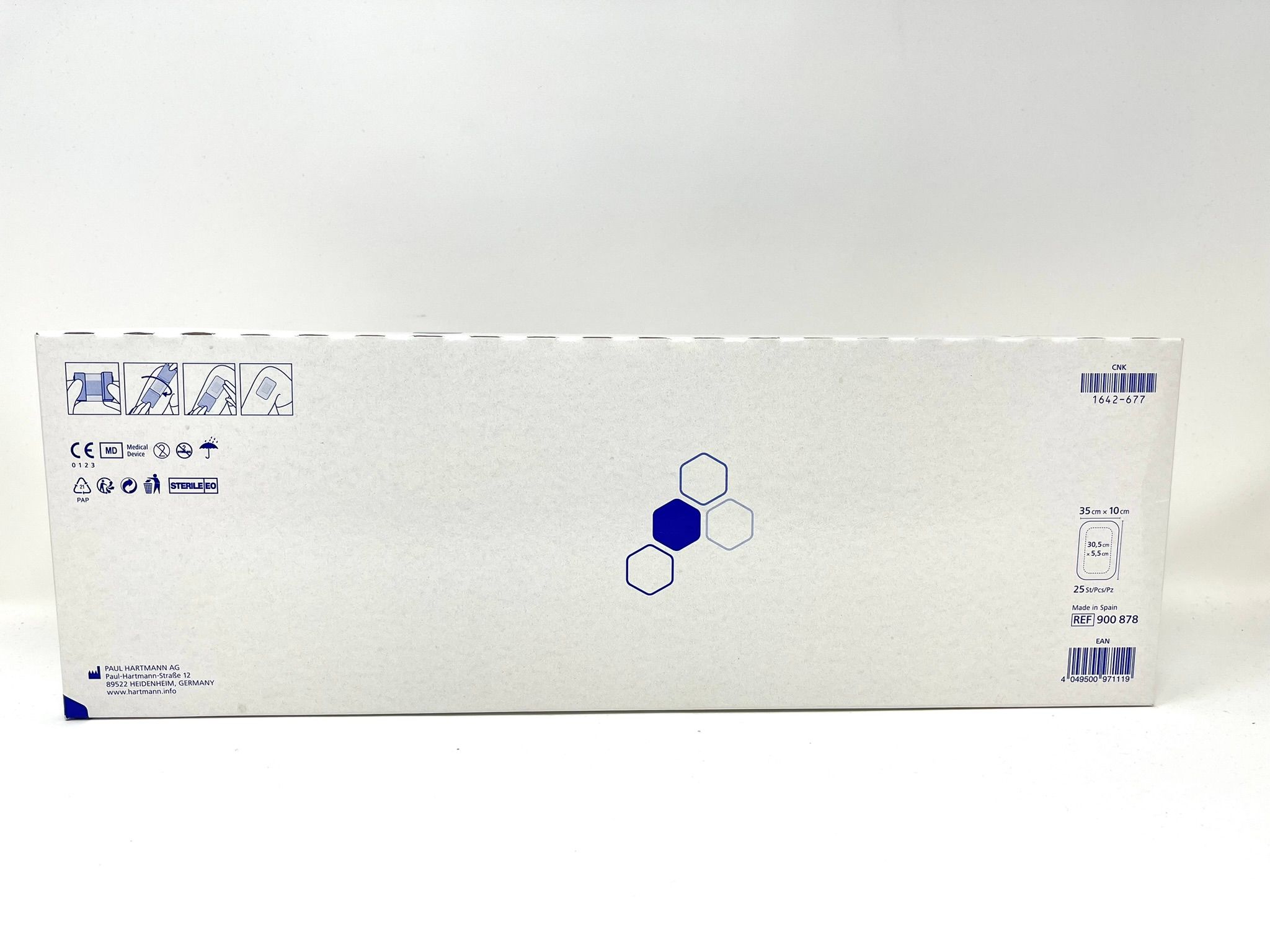 Emballage blanc avec symboles et texte bleus. Comprend marquage CE, dimensions 35cm x 10cm et code-barres.