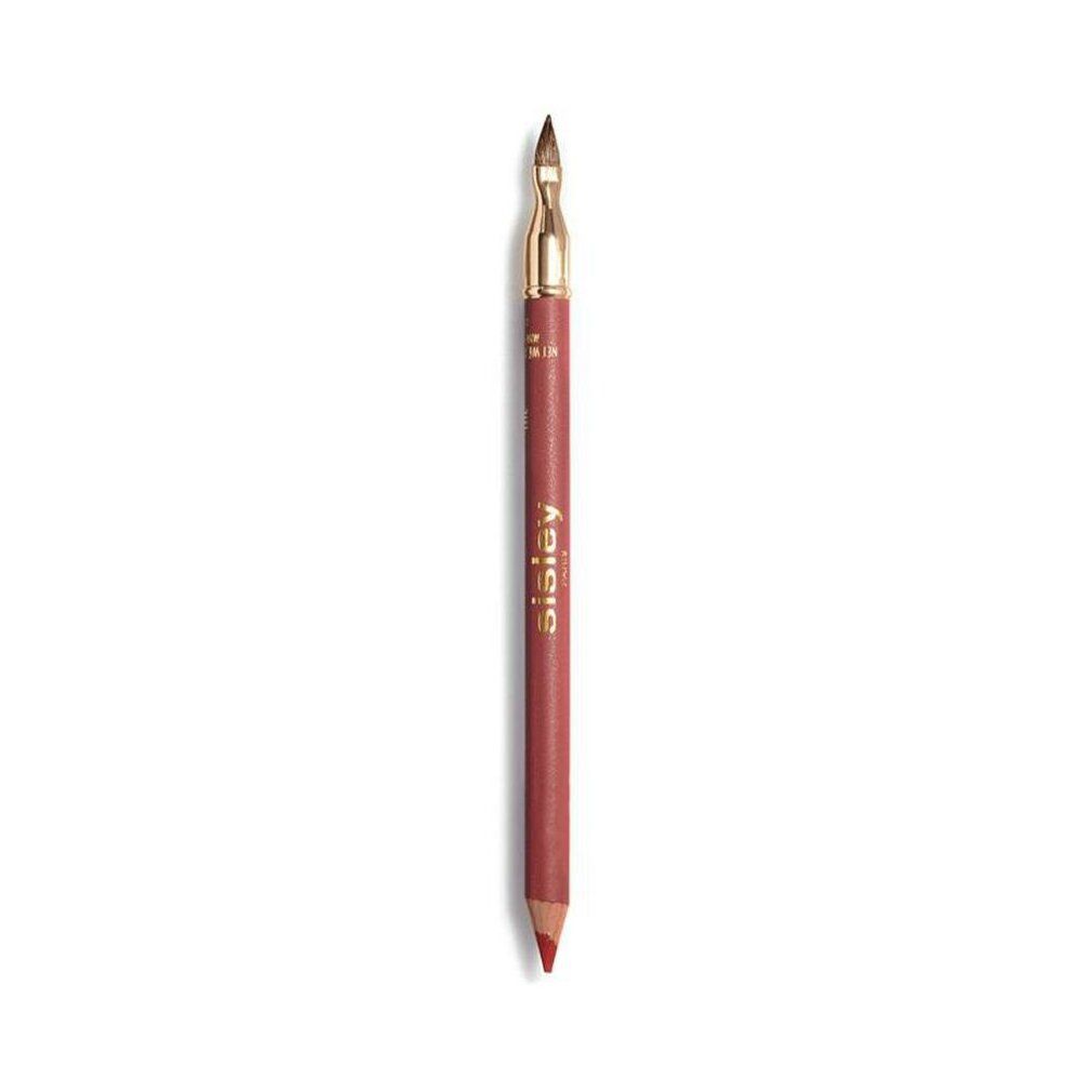 Crayon à lèvres Sisley Phyto-Lèvres Perfect. Crayon rose avec capuchon doré et pinceau. Sur fond blanc.
