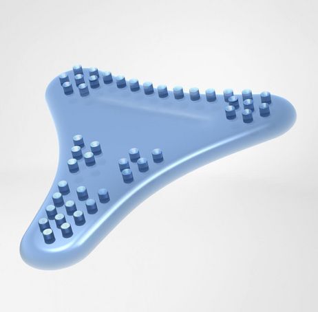 Élément bleu en forme de goutte avec des picots. Dessus avec de petites protubérances rondes.