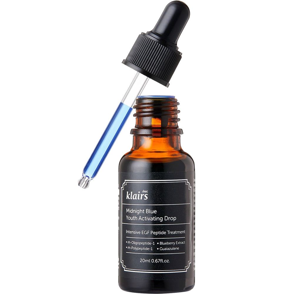 Flacon en verre brun avec étiquette noire et pipette. Pipette dans le goulot. Nom du produit et détails visibles.