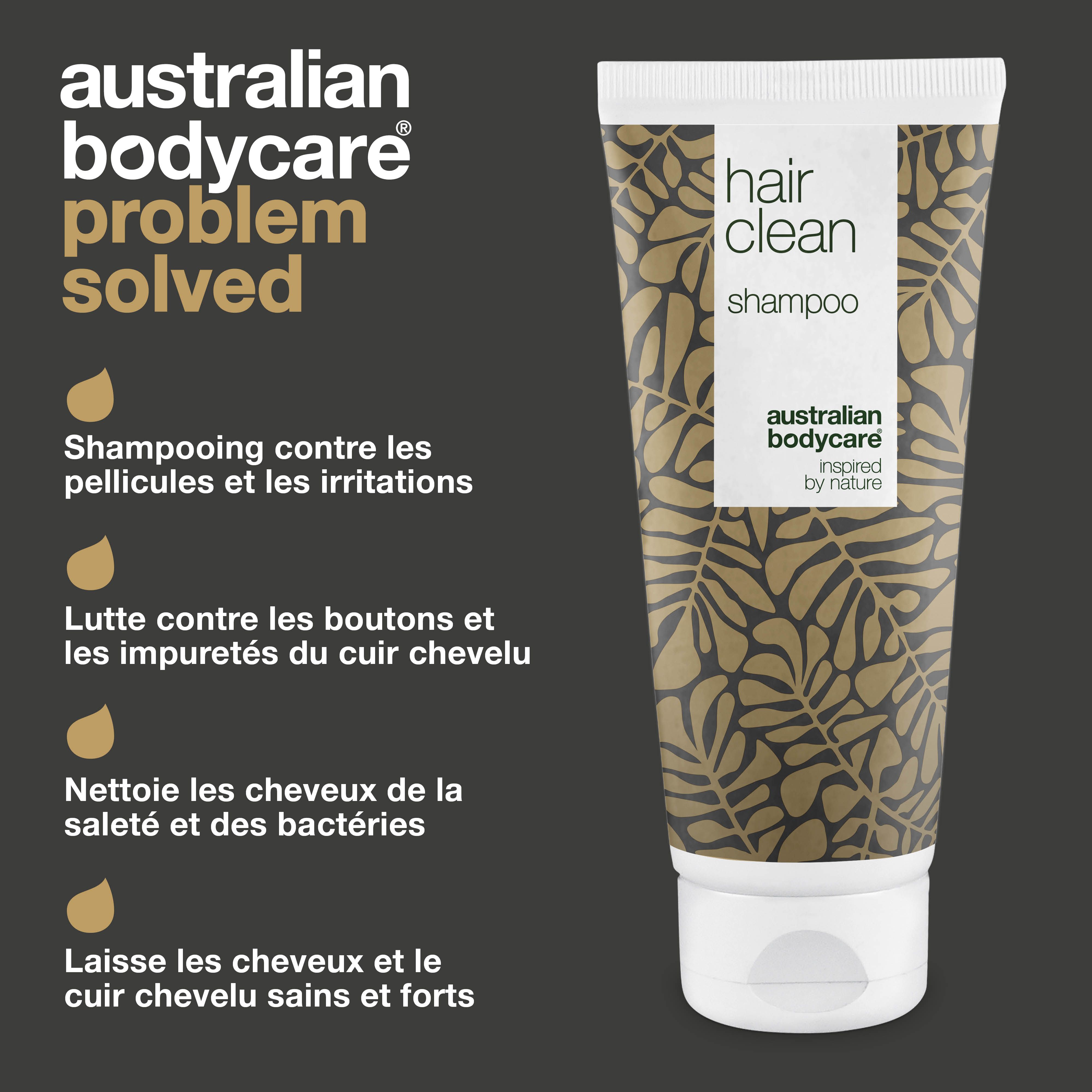 Tube de shampooing. Texte : "hair clean shampoo". Motif feuilles dorées. Texte : Shampooing contre les pellicules.